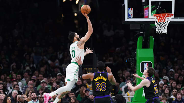 Feb 1, 2024; Boston, Massachusetts, USA; Boston Celtics forward Jayson Tatum (0) shoots the balklk against Los Angeles Lakers forward Rui Hachimura (28) in the second quarter at TD Garden. Mandatory Credit: David Butler II-Imagn Images
