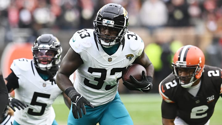 Dec 10, 2023; Cleveland, Ohio, USA; Jacksonville Jaguars linebacker Devin Lloyd (33) returns a fumble during the first half against the Cleveland Browns at Cleveland Browns Stadium. Mandatory Credit: Ken Blaze-Imagn Images