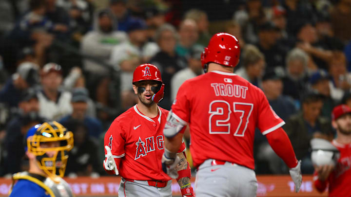 Sep 11, 2025; Seattle, Washington, USA; ç (27) celebrate after Trout hit a home run against the Seattle Mariners during the fifth inning at T-Mobile Park. Mandatory Credit: Steven Bisig-Imagn Images