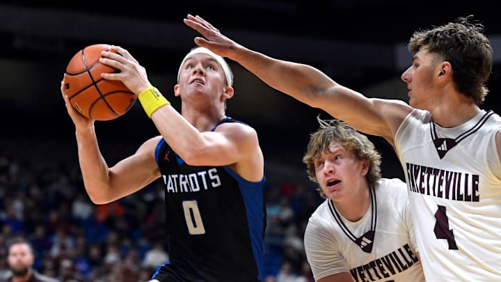 Valley’s Carson Tucker drives to the net as Fayetteville defenders Kasen Kocian (center) and Jack Schley attempt to block during the Class 1A Div. 1 state basketball championship in San Antonio Thursday March 12, 2026. Final score was 66-48, Valley.