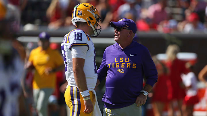 Sep 27, 2025; Oxford, Mississippi, USA; LSU Tigers head coach Brian Kelly talks with quarterback Garrett Nussmeier (18) during warm ups prior to the game against the Mississippi Rebels at Vaught-Hemingway Stadium. Mandatory Credit: Petre Thomas-Imagn Images