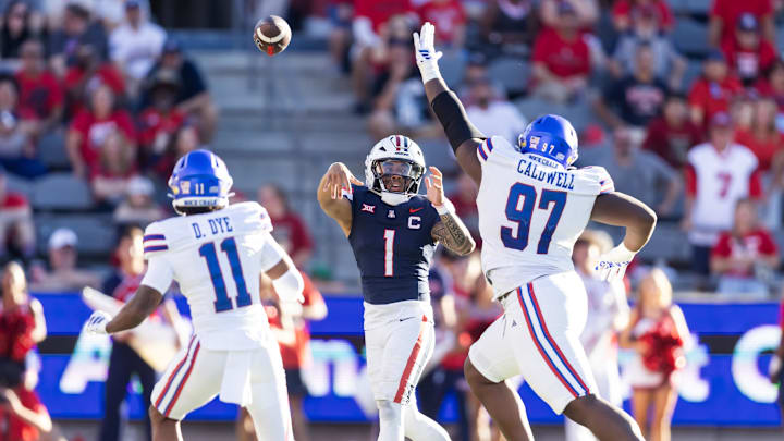 Nov 8, 2025; Tucson, Arizona, USA; Arizona Wildcats quarterback Noah Fifita (1) throws a pass against the Kansas Jayhawks in the second half at Arizona Stadium. Mandatory Credit: Mark J. Rebilas-Imagn Images