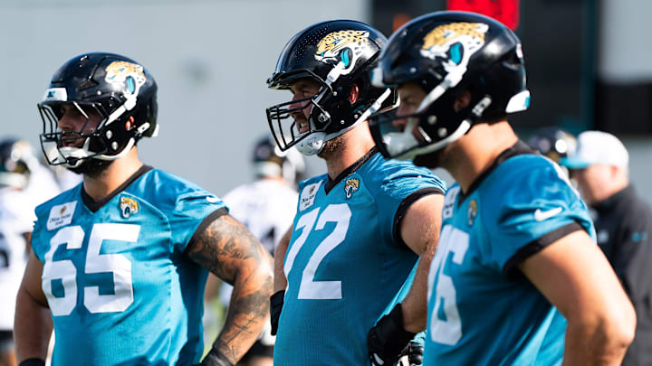 Jacksonville Jaguars guard Patrick Mekari (65), Jacksonville Jaguars offensive tackle Walker Little (72) and Jacksonville Jaguars guard Ezra Cleveland (76) warm up during the Jacksonville Jaguars’ third mandatory minicamp Thursday June 12, 2025 at the Miller Electric Center in Jacksonville, Fla. ç