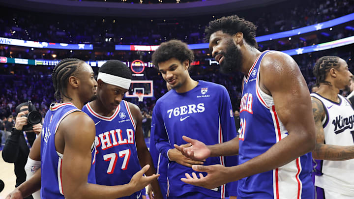 Jan 29, 2026; Philadelphia, Pennsylvania, USA; Philadelphia 76ers center Joel Embiid (21) reacts with Philadelphia 76ers guard Tyrese Maxey (L) in front of guard Vj Edgecombe (77) after a victory against the Sacramento Kings at Xfinity Mobile Arena. Mandatory Credit: Bill Streicher-Imagn Images