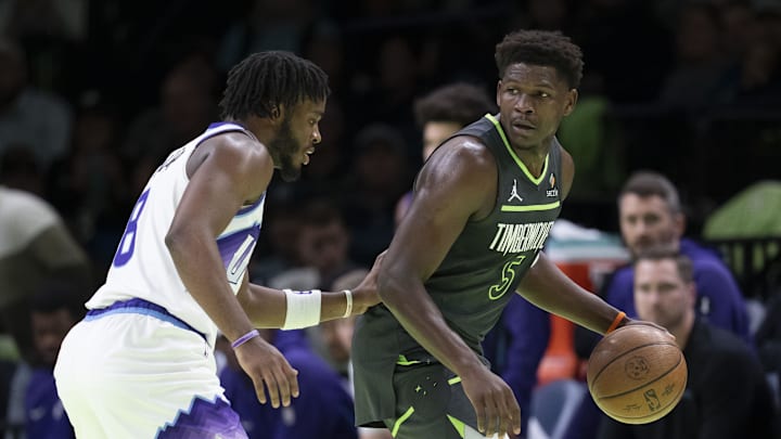 Nov 7, 2025; Minneapolis, Minnesota, USA; Minnesota Timberwolves guard Anthony Edwards (5) dribbles the ball as Utah Jazz guard Isaiah Collier (8) plays defense in the first half at Target Center. Mandatory Credit: Jesse Johnson-Imagn Images