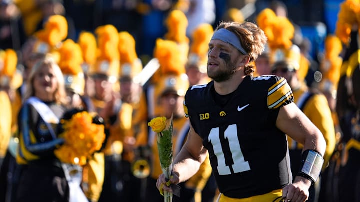 Iowa Hawkeyes quarterback Mark Gronowski (11) runs onto the field during senior recognition Nov. 22, 2025 at Kinnick Stadium in Iowa City, Iowa.