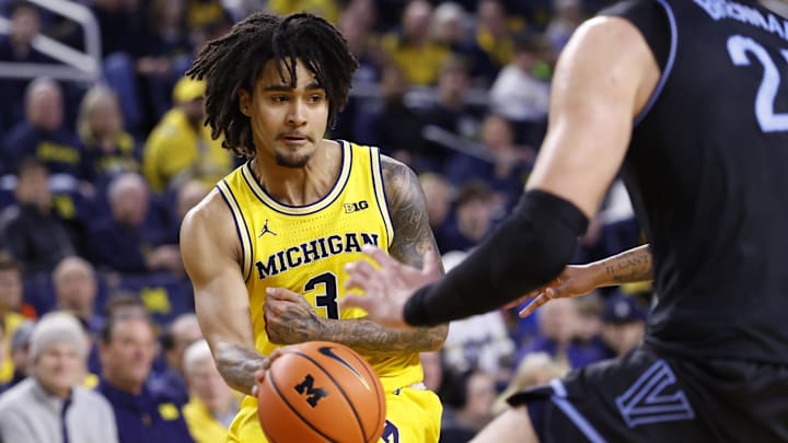 Dec 9, 2025; Ann Arbor, Michigan, USA;  Michigan Wolverines guard Elliot Cadeau (3) passes in the first half against the Villanova Wildcats at Crisler Center. Mandatory Credit: Rick Osentoski-Imagn Images