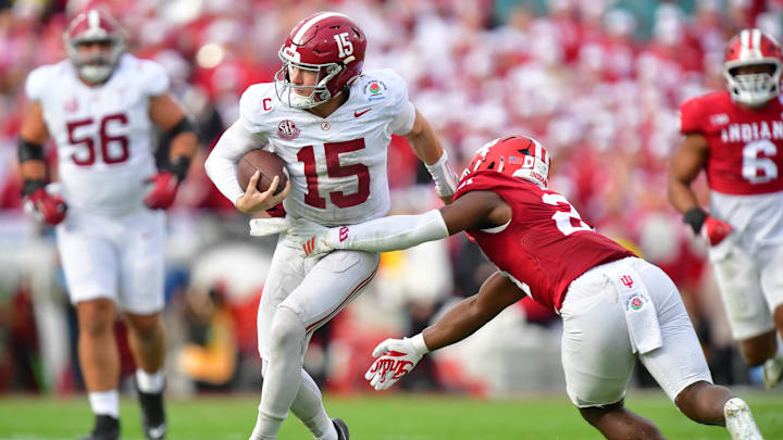 Jan 1, 2026; Pasadena, CA, USA; Alabama Crimson Tide quarterback Ty Simpson (15) runs against Indiana Hoosiers linebacker Rolijah Hardy (21) in the first half of the 2026 Rose Bowl and quarterfinal game of the College Football Playoff at Rose Bowl Stadium. Mandatory Credit: Gary A. Vasquez-Imagn Images