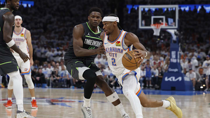 Oklahoma City Thunder guard Shai Gilgeous-Alexander (2) drives against Minnesota Timberwolves guard Anthony Edwards (5) in the fourth quarter during game one of the western conference finals for the 2025 NBA Playoffs at Paycom Center. Oklahoma City Thunder guard Shai Gilgeous-Alexander (2) drives against Minnesota Timberwolves guard Anthony Edwards (5) in the fourth quarter during game one of the western conference finals for the 2025 NBA Playoffs at Paycom Center.