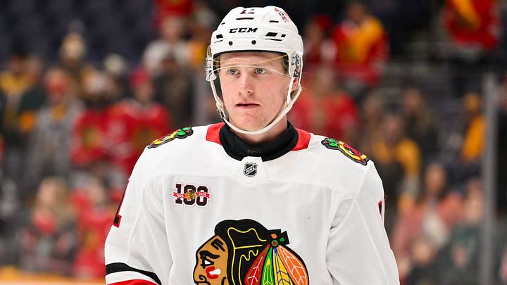 Feb 26, 2026; Nashville, Tennessee, USA;  Chicago Blackhawks center Oliver Moore (11) against the Nashville Predators during the first period at Bridgestone Arena. Mandatory Credit: Steve Roberts-Imagn Images