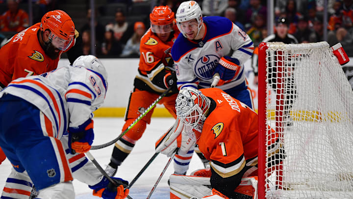 Anaheim Ducks goaltender Lukas Dostal (1) defends the goal against Edmonton Oilers center Ryan Nugent-Hopkins (93) and left wing Zach Hyman (18)