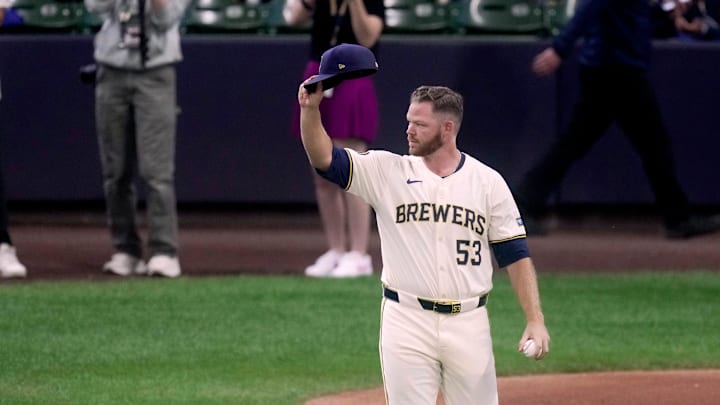 Injured Milwaukee Brewers pitcher Brandon Woodruff acknowledges the cheers of fans as heads out to throw the ceremonial first pitch before their wild-card playoff game against the New York Mets Tuesday, October 1, 2024, at American Family Field in Milwaukee, Wis. Injured Milwaukee Brewers pitcher Brandon Woodruff acknowledges the cheers of fans as heads out to throw the ceremonial first pitch before their wild-card playoff game against the New York Mets Tuesday, October 1, 2024, at American Family Field in Milwaukee, Wis.