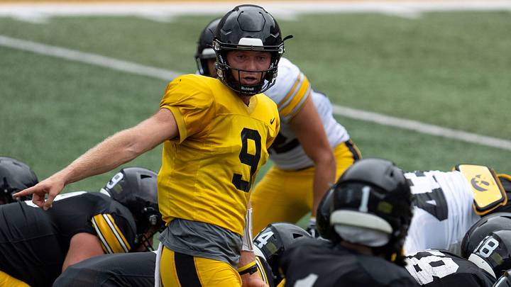 Iowa quarterback Hank Brown (9) calls out a play Aug. 15, 2026 during the Kids Day at Kinnick open practice at Kinnick Stadium in Iowa City, Iowa. Iowa quarterback Hank Brown (9) calls out a play Aug. 15, 2026 during the Kids Day at Kinnick open practice at Kinnick Stadium in Iowa City, Iowa.