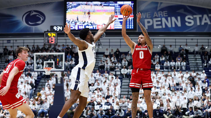 Jan 22, 2026; University Park, Pennsylvania, USA; Wisconsin Badgers guard Braeden Carrington (0) shoots against Penn State Nittany Lions forward Josh Reed (10) during the first half at Rec Hall. Mandatory Credit: Matthew O'Haren-Imagn Images
