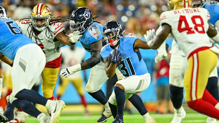 Aug 10, 2024; Nashville, Tennessee, USA;  Tennessee Titans running back Jabari Small (31) runs the ball against the San Francisco 49ers during the second half at Nissan Stadium. Mandatory Credit: Steve Roberts-Imagn Images