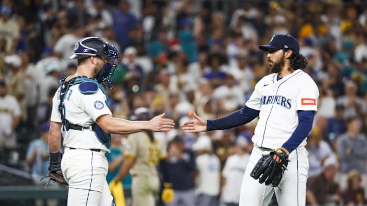 Aug 25, 2025; Seattle, Washington, USA; Seattle Mariners pitcher Andrés Muñoz (75) shakes hands with catcher Mitch Garver (18) following the final out of a victory against the San Diego Padres at T-Mobile Park. Mandatory Credit: Joe Nicholson-Imagn Images Aug 25, 2025; Seattle, Washington, USA; Seattle Mariners pitcher Andrés Muñoz (75) shakes hands with catcher Mitch Garver (18) following the final out of a victory against the San Diego Padres at T-Mobile Park. Mandatory Credit: Joe Nicholson-Imagn Images
