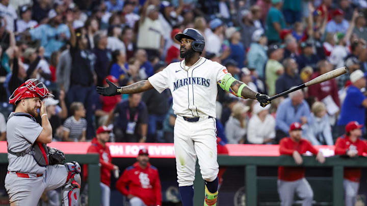 Sep 9, 2025; Seattle, Washington, USA; Seattle Mariners left fielder Randy Arozarena (56) reacts towards the Mariners dugout after hitting a three-run home run against the St. Louis Cardinals during the third inning at T-Mobile Park. St. Louis Cardinals catcher Pedro Pages (43) kneels at left. Mandatory Credit: Joe Nicholson-Imagn Images