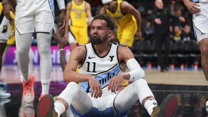 Mar 8, 2025; Atlanta, Georgia, USA; Atlanta Hawks guard Trae Young (11) sits on the court after being fouled by Indiana Pacers forward Pascal Siakam (43) during the first quarter at State Farm Arena. Mandatory Credit: Mady Mertens-Imagn Images Mar 8, 2025; Atlanta, Georgia, USA; Atlanta Hawks guard Trae Young (11) sits on the court after being fouled by Indiana Pacers forward Pascal Siakam (43) during the first quarter at State Farm Arena. Mandatory Credit: Mady Mertens-Imagn Images