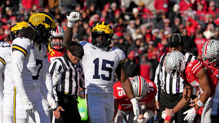 Michigan Wolverines linebacker Ernest Hausmann (15) celebrates after tackling Ohio State Buckeyes quarterback Will Howard (18) during the first half of Saturday’s NCAA Division I football game at Ohio Stadium.