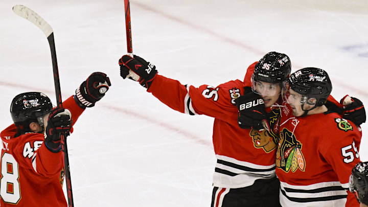 Oct 13, 2025; Chicago, Illinois, USA;  Chicago Blackhawks right wing Ilya Mikheyev (95) celebrates with defenseman Matt Grzelcyk (48) and  left wing Tyler Bertuzzi (59) after he scores a goal against the Utah Mammoth  during the second period at United Center. Mandatory Credit: Matt Marton-Imagn Images