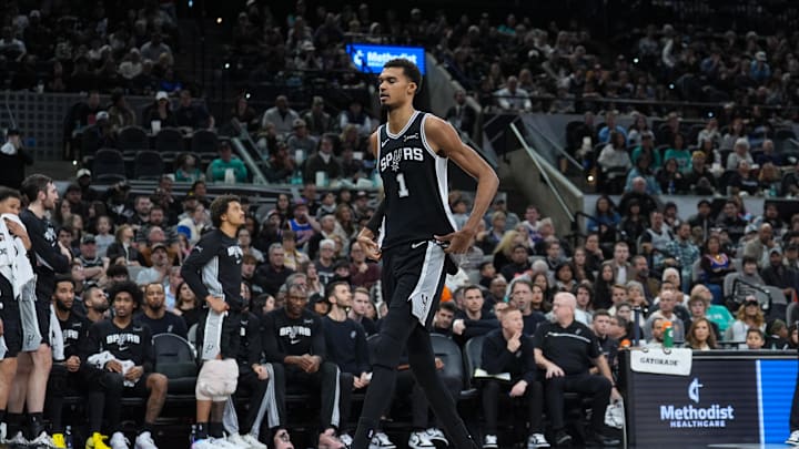 Dec 31, 2025; San Antonio, Texas, USA;  San Antonio Spurs forward Victor Wembanyama (1) leaves the game after an injury in the second half against the New York Knicks at Frost Bank Center. Mandatory Credit: Daniel Dunn-Imagn Images