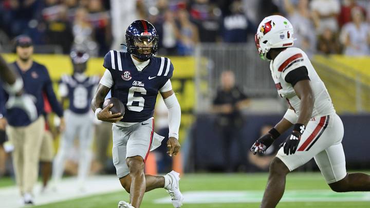 Mississippi Rebels quarterback Trinidad Chambliss (6) carries the ball against the Louisville Cardinals during the fourth quarter at Nissan Stadium. Mandatory Credit: Steve Roberts-Imagn Images Mississippi Rebels quarterback Trinidad Chambliss (6) carries the ball against the Louisville Cardinals during the fourth quarter at Nissan Stadium. Mandatory Credit: Steve Roberts-Imagn Images