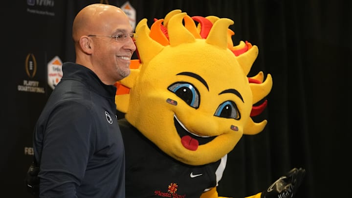 Penn State Nittany Lions head coach James Franklin poses with mascot Spirit
