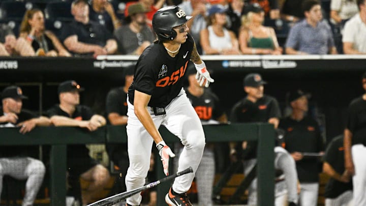 Jun 13, 2025; Omaha, Neb, USA; Oregon State Beavers shortstop Aiva Arquette (13) singles against the Louisville Cardinals during the ninth inning at Charles Schwab Field. Mandatory Credit: Steven Branscombe-Imagn Images