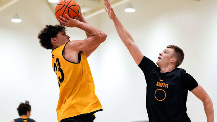 Iowa’s Isaia Howard (23) shoots as Bennett Stirtz (14) defends during practice June 19, 2025 at Carver-Hawkeye Arena in Iowa City, Iowa.
