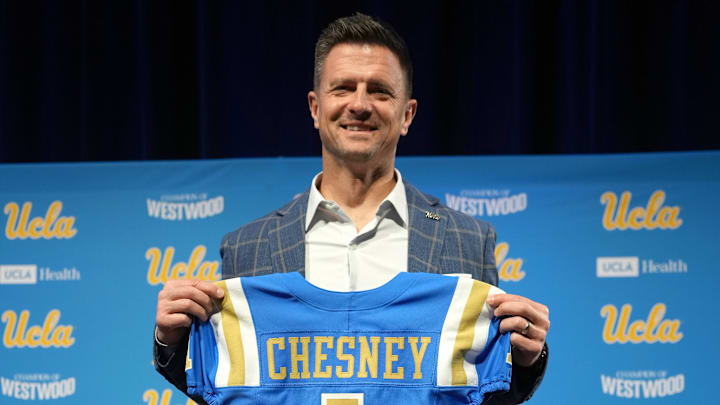 Dec 9, 2025; Los Angeles, CA, USA; UCLA Bruins football coach Bob Chesney poses at introductory press conference at Renee Luskin Conference Center Centennial Ballroom. Mandatory Credit: Kirby Lee-Imagn Images Dec 9, 2025; Los Angeles, CA, USA; UCLA Bruins football coach Bob Chesney poses at introductory press conference at Renee Luskin Conference Center Centennial Ballroom. Mandatory Credit: Kirby Lee-Imagn Images