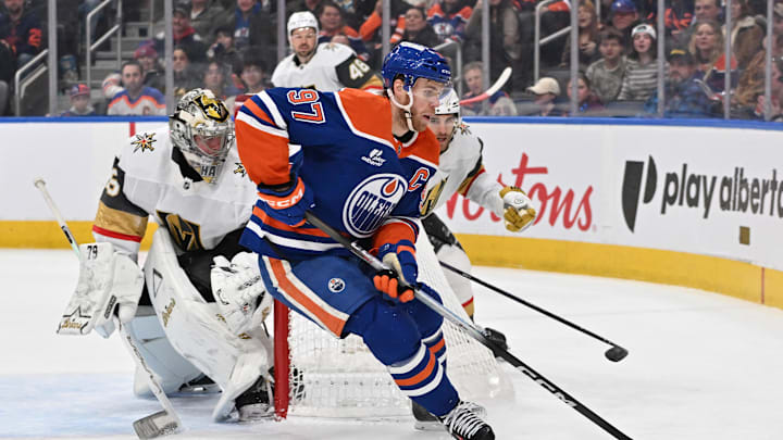 Dec 21, 2025; Edmonton, Alberta, CAN; Edmonton Oilers center Connor McDavid (97) with Vegas Golden Knights goalie Carter Hart (79) are seen out on the ice during the first period at Rogers Place. Mandatory Credit: Walter Tychnowicz-Imagn Images