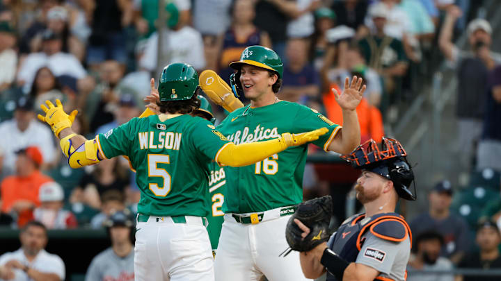 Aug 26, 2025; West Sacramento, California, USA; Athletics shortstop Jacob Wilson (5), left, celebrates with first baseman Nick Kurtz (16) at home plate after hitting a three run home run during the first inning against the Detroit Tigers at Sutter Health Park. Mandatory Credit: Sergio Estrada-Imagn Images