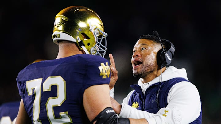 Notre Dame head coach Marcus Freeman coaches offensive lineman Sam Pendleton (72) after Pendleton received an unsportsmanlike conduct penalty during a NCAA college football game against Florida State at Notre Dame Stadium on Saturday, Nov. 9, 2024, in South Bend.