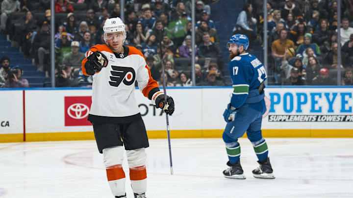 Dec 30, 2025; Vancouver, British Columbia, CAN; Vancouver Canucks defenseman Filip Hronek (17) reacts as Philadelphia Flyers forward Bobby Brink (10) celebrates his goal in the third period at Rogers Arena. Mandatory Credit: Bob Frid-Imagn Images