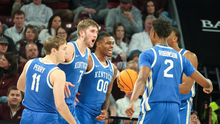 Jan 11, 2025; Starkville, Mississippi, USA; Kentucky Wildcats guard Travis Perry (11), forward Andrew Carr (7), and guard Otega Oweh (0) react after a basket against the Mississippi State Bulldogs during the second half  at Humphrey Coliseum. Mandatory Credit: Wesley Hale-Imagn Images