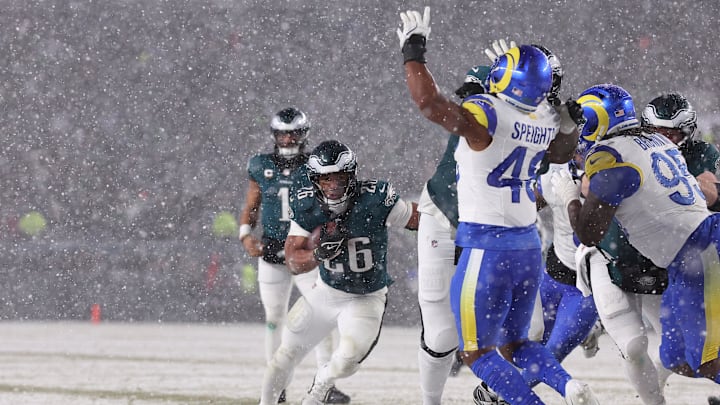 Jan 19, 2025; Philadelphia, Pennsylvania, USA; Philadelphia Eagles running back Saquon Barkley (26) carries the ball against the Los Angeles Rams in the second half in a 2025 NFC divisional round game at Lincoln Financial Field. Mandatory Credit: Bill Streicher-Imagn Images Jan 19, 2025; Philadelphia, Pennsylvania, USA; Philadelphia Eagles running back Saquon Barkley (26) carries the ball against the Los Angeles Rams in the second half in a 2025 NFC divisional round game at Lincoln Financial Field. Mandatory Credit: Bill Streicher-Imagn Images