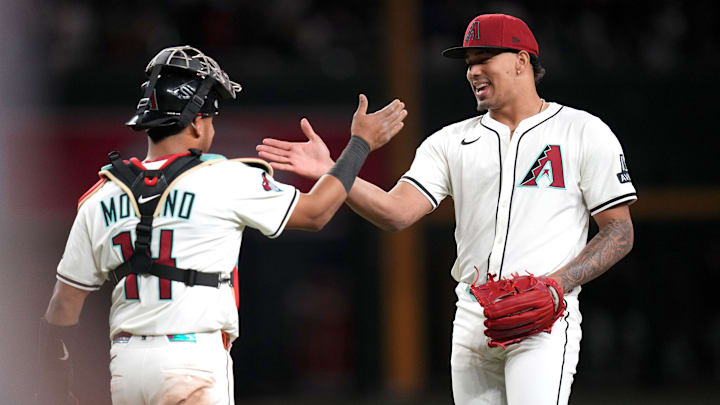 Arizona Diamondbacks closer Justin Martinez (63) high-fives teammate Gabriel Moreno (14) after their 4-3 win over the Baltimore Orioles at Chase Field in Phoenix on April 8, 2025. Arizona Diamondbacks closer Justin Martinez (63) high-fives teammate Gabriel Moreno (14) after their 4-3 win over the Baltimore Orioles at Chase Field in Phoenix on April 8, 2025.