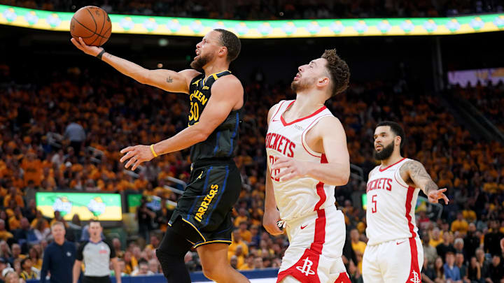Golden State Warriors guard Stephen Curry (30) drives to the hoop in front of Houston Rockets center Alperen Sengun (28) in the third quarter of game six of the first round for the 2025 NBA Playoffs at Chase Center. Mandatory Credit: Cary Edmondson-Imagn Images
