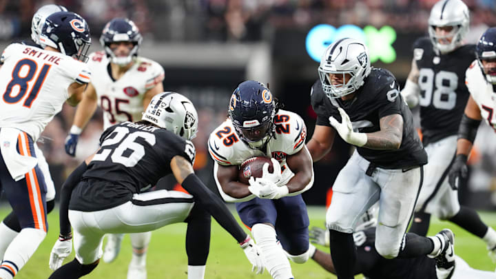 Sep 28, 2025; Paradise, Nevada, USA; Chicago Bears running back Kyle Monangai (25) runs the ball against Las Vegas Raiders cornerback Darien Porter (26) during the second half at Allegiant Stadium. Mandatory Credit: Stephen R. Sylvanie-Imagn Images