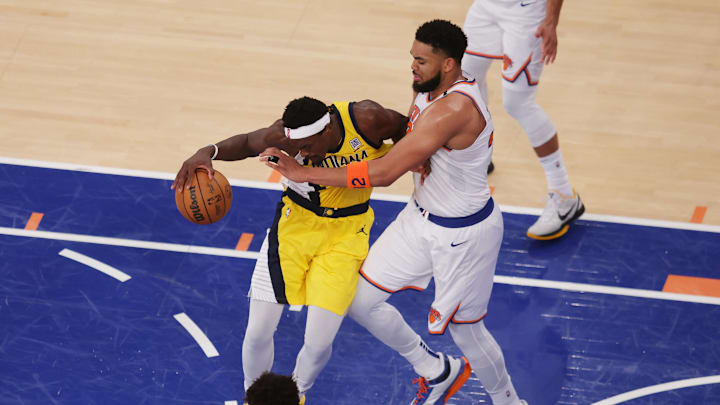 Indiana Pacers forward Pascal Siakam controls the ball against New York Knicks center Karl-Anthony Towns. Mandatory Credit: Brad Penner-Imagn Images