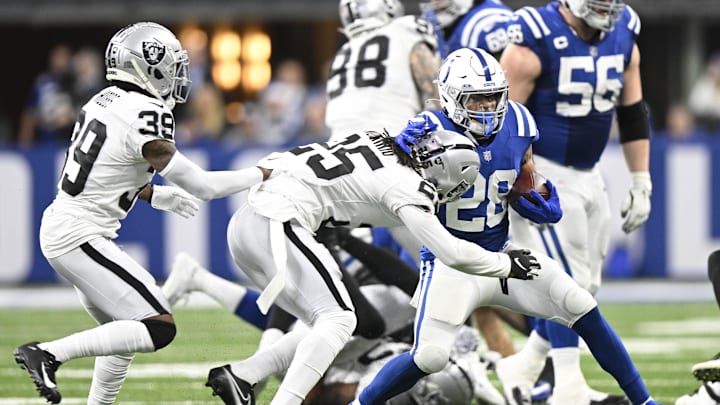 Jan 2, 2022; Indianapolis, Indiana, USA; Indianapolis Colts running back Jonathan Taylor (28) is tackled by Las Vegas Raiders free safety Trevon Moehrig (25) during the second half at Lucas Oil Stadium. Raiders won 23-20. Mandatory Credit: Marc Lebryk-Imagn Images Jan 2, 2022; Indianapolis, Indiana, USA; Indianapolis Colts running back Jonathan Taylor (28) is tackled by Las Vegas Raiders free safety Trevon Moehrig (25) during the second half at Lucas Oil Stadium. Raiders won 23-20. Mandatory Credit: Marc Lebryk-Imagn Images