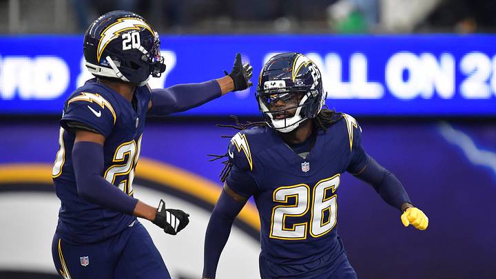 Dec 27, 2025; Inglewood, California, USA; Los Angeles Chargers cornerback Donte Jackson (26) and cornerback Cam Hart (20) celebrate a pass defense against the Houston Texans during the second half at SoFi Stadium. Mandatory Credit: Gary A. Vasquez-Imagn Images Dec 27, 2025; Inglewood, California, USA; Los Angeles Chargers cornerback Donte Jackson (26) and cornerback Cam Hart (20) celebrate a pass defense against the Houston Texans during the second half at SoFi Stadium. Mandatory Credit: Gary A. Vasquez-Imagn Images