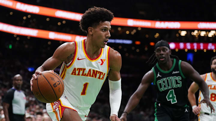 Nov 12, 2024; Boston, Massachusetts, USA; Atlanta Hawks forward Jalen Johnson (1) drives the ball against Boston Celtics guard Jrue Holiday (4) in the second quarter at TD Garden. Mandatory Credit: David Butler II-Imagn Images Nov 12, 2024; Boston, Massachusetts, USA; Atlanta Hawks forward Jalen Johnson (1) drives the ball against Boston Celtics guard Jrue Holiday (4) in the second quarter at TD Garden. Mandatory Credit: David Butler II-Imagn Images