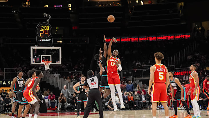 Mar 23, 2026; Atlanta, Georgia, USA; Atlanta Hawks forward Onyeka Okongwu (17) wins the opening tip off from Memphis Grizzlies forward Olivier-Maxence Prosper (18) during the first half at State Farm Arena. Mandatory Credit: Dale Zanine-Imagn Images