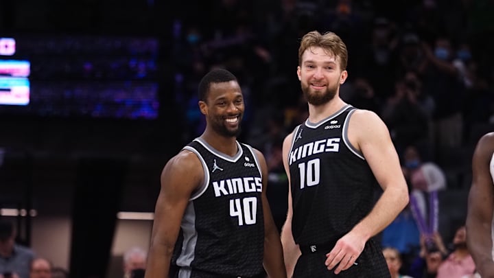 Feb 9, 2022; Sacramento, California, USA; Sacramento Kings forward Harrison Barnes (40) and center Domantas Sabonis (10) smiles in the final seconds of the game against the Minnesota Timberwolves during the fourth quarter at Golden 1 Center. Mandatory Credit: Kelley L Cox-Imagn Images