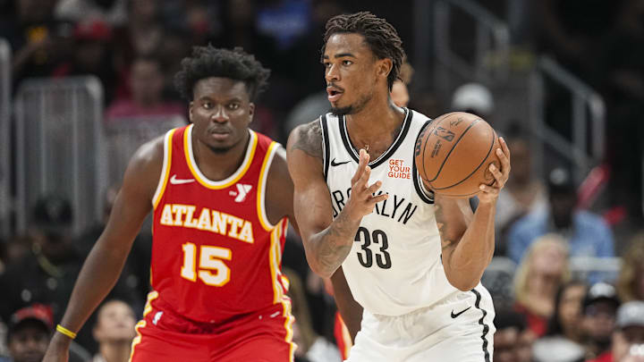 Oct 23, 2024; Atlanta, Georgia, USA; Brooklyn Nets center Nic Claxton (33) handles the ball against the Atlanta Hawks during the second half at State Farm Arena. Mandatory Credit: Dale Zanine-Imagn Images