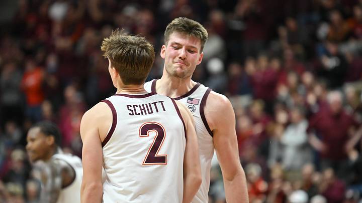 Dec 31, 2025; Blacksburg, Virginia, USA; Virginia Tech Hokies guard Jaden Schutt (2) and Virginia Tech Hokies center Christian Gurdak (32) celebrate a three point shot by Schutt (2) during the second overtime period at Cassell Coliseum. Mandatory Credit: Brian Bishop-Imagn Images