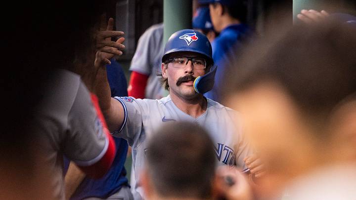 Jun 17, 2026; Boston, Massachusetts, USA; Toronto Blue Jays left fielder Davis Schneider (36) is greeted in the dugout after scoring off a single hit by shortstop Andrés Giménez (0), not pictured, in the third inning against the Boston Red Sox at Fenway Park. Mandatory Credit: Jaiden Tripi-Imagn Images