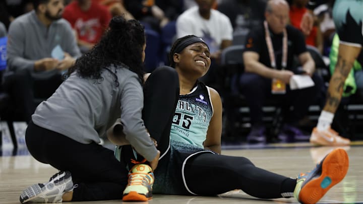 Jun 5, 2025; Washington, District of Columbia, USA; New York Liberty center Jonquel Jones (35) is attended to by a member of the Liberty training staff after being injured against the Washington Mystics in the first half at Entertainment & Sports Arena. Mandatory Credit: Geoff Burke-Imagn Images
