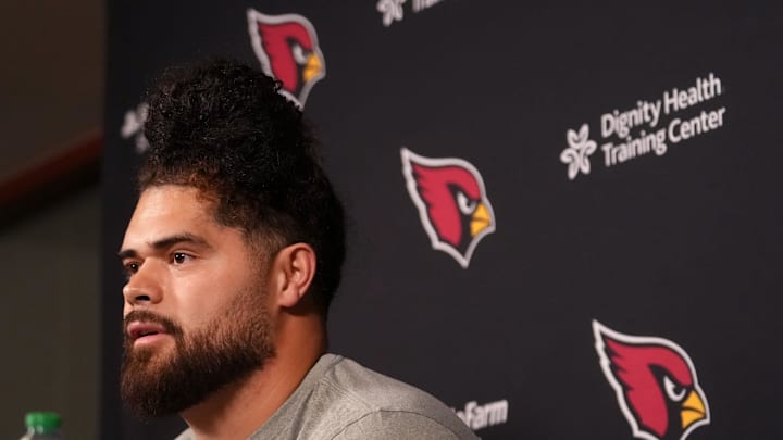 Arizona Cardinals newly signed free agent Isaac Seumalo speaks to the press at the Arizona Cardinals training facility in Tempe, on March 11, 2026.